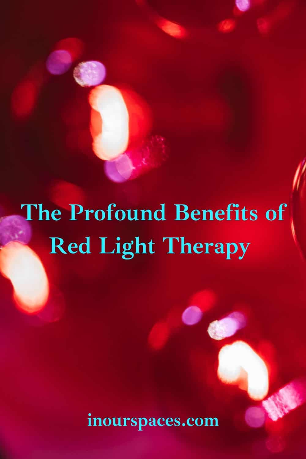 image with text of blurry photo of red light bulbs emitting red glow. Text reads "The Profound benefits of red light therapy, in our spaces dot com