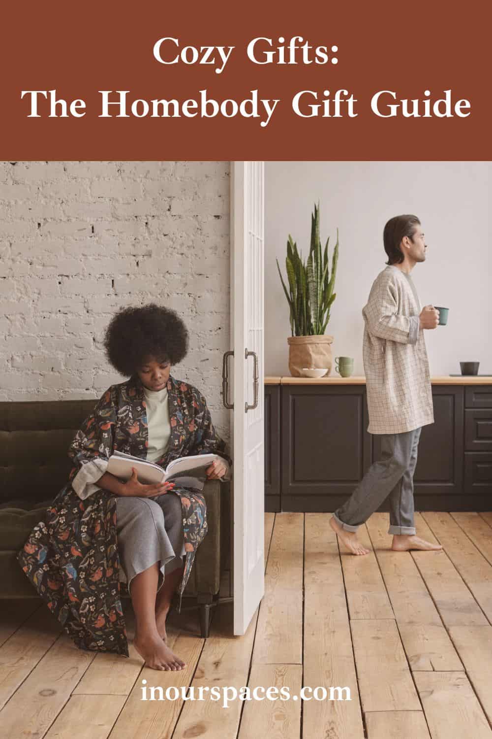 image with text cozy gifts the home body gift guide image of man in the background of a kitchen holding a mug and woman in the front of the home sitting holding a book