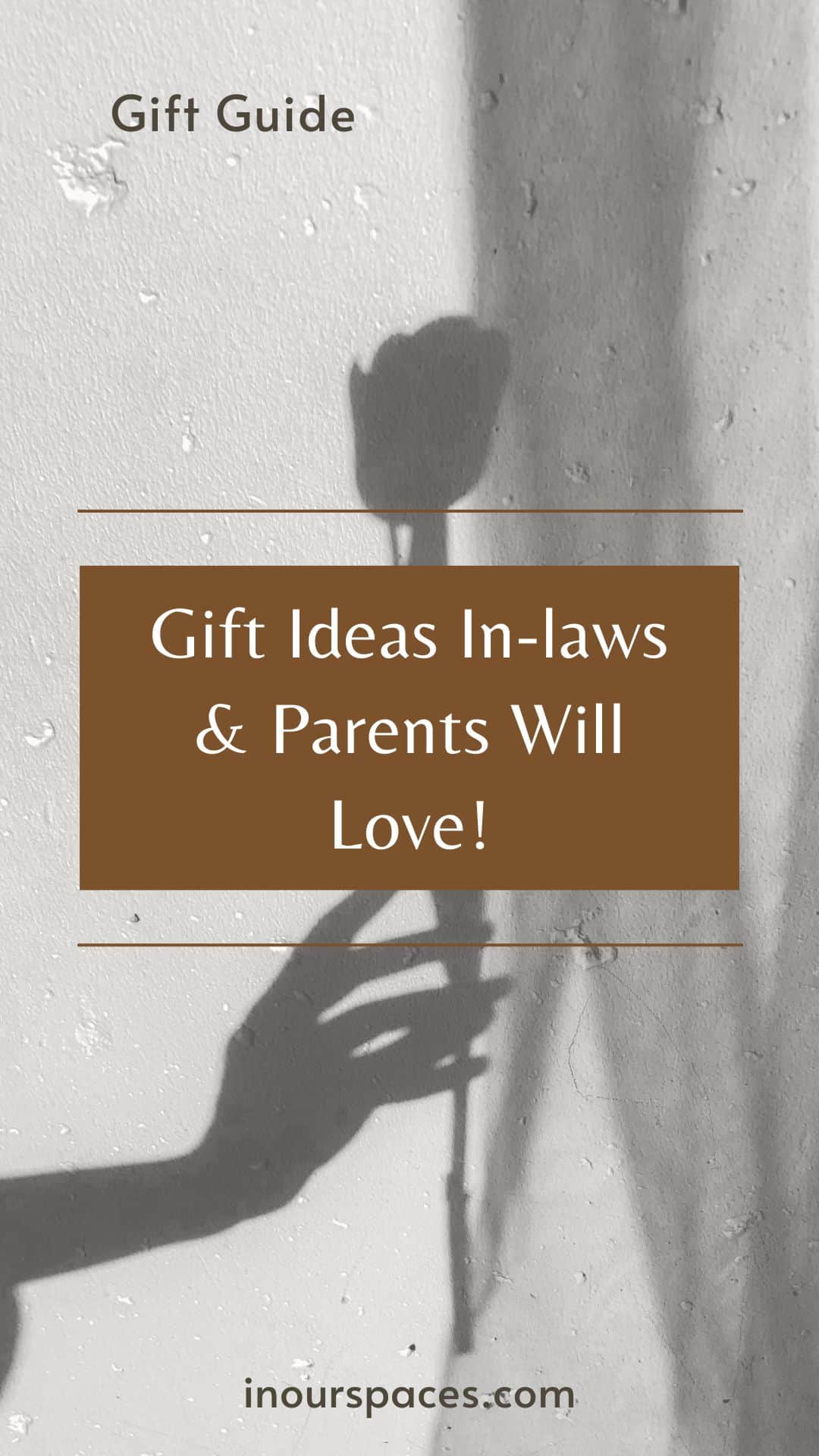 image with text. shadow image of female hand hold a rose, text reads gift guide, gifts ideas in-laws parents grandparents and others couples will love in our spaces dot com