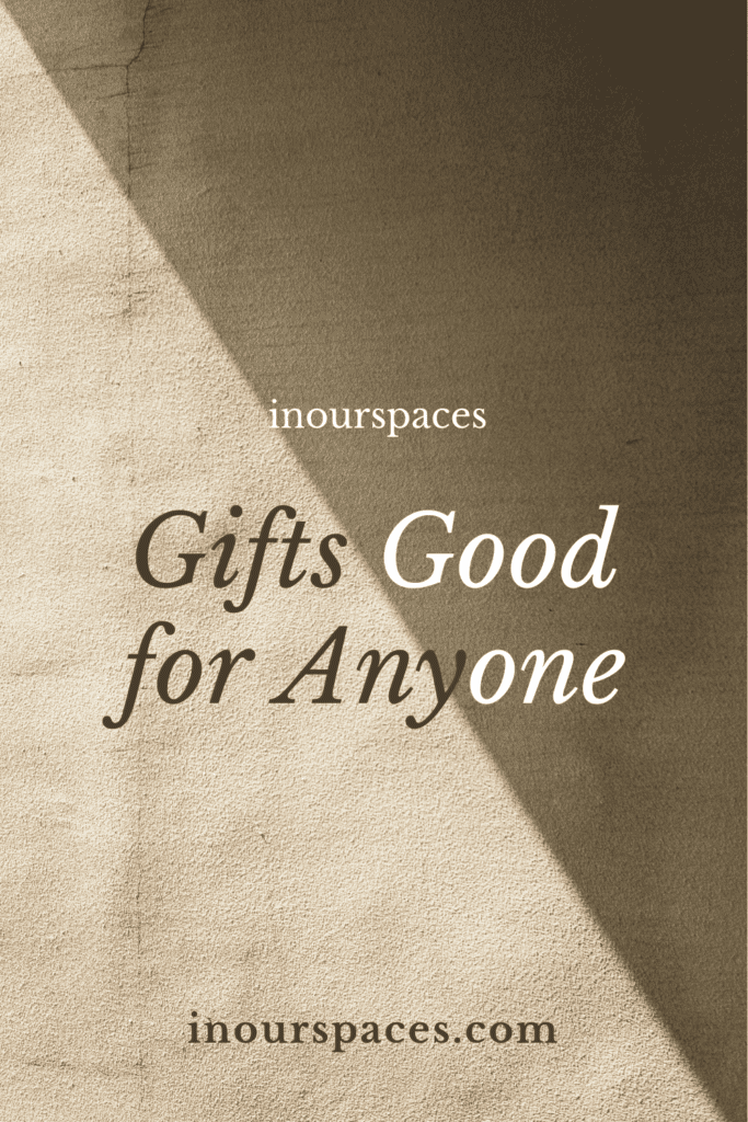 Minimalist beige textured background with soft shadow and the text “inourspaces – Gifts Good for Anyone – inourspaces.com,” gift guide pinterest banner